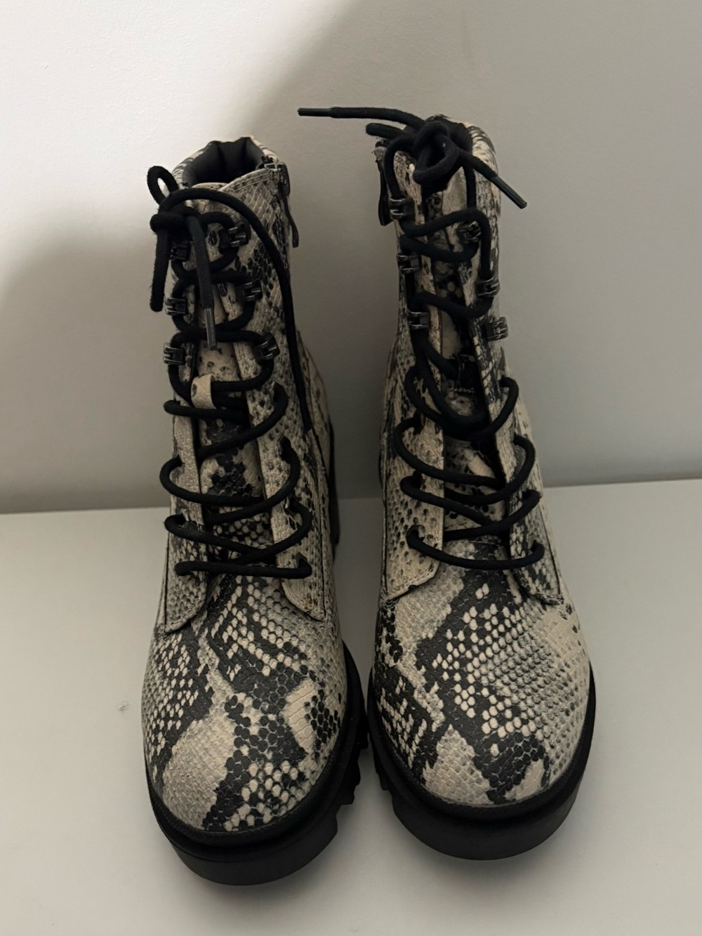 MADDEN GIRL Snake-Print Lace-Up Combat Boots in Black and White
